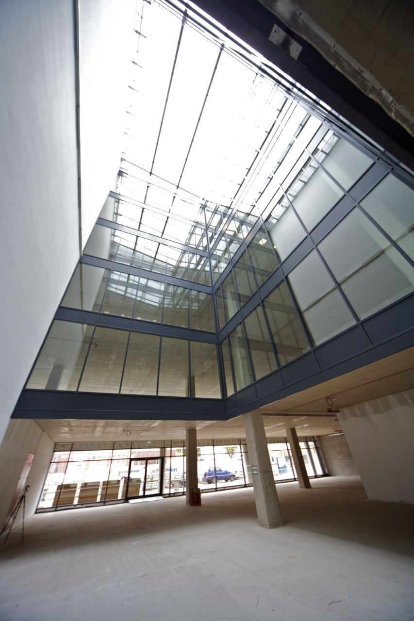 Multi-storey glazed atrium with fire resistant glass screens and rooflight