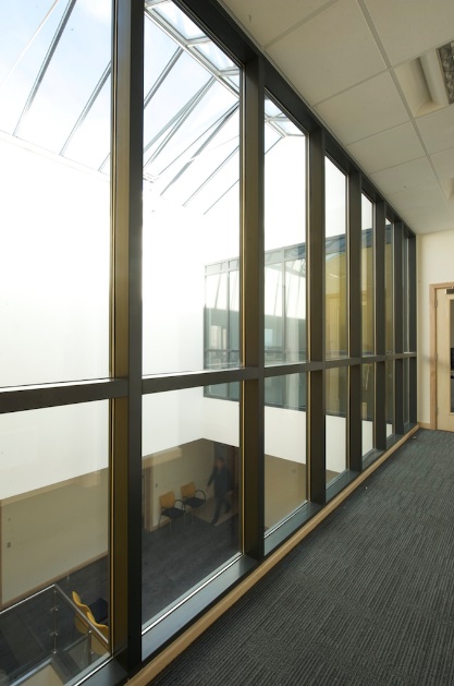 Full height glazed screen along an escape corridor