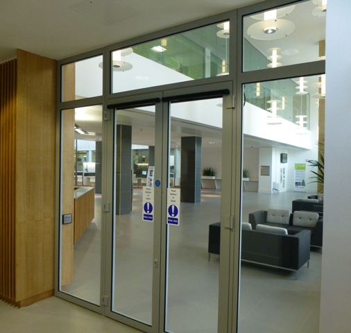 Pair of glazed fire doors with overpanels